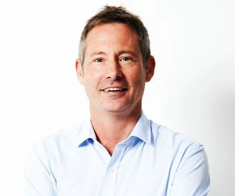 Tui's UK boss Andrew Flintham has apologised for delays handling customers cancelled bookings
