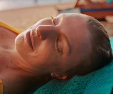 The campaign featured a number of people relaxing on the beach after terrible times