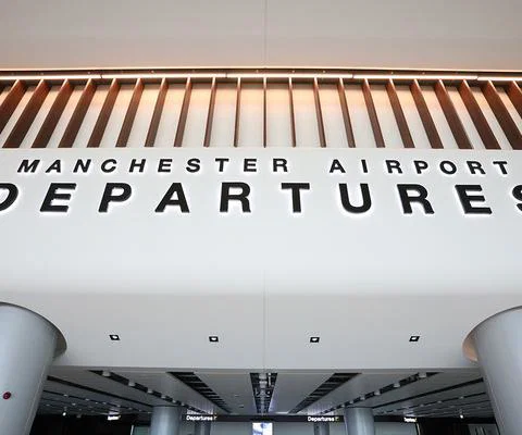 Manchester airport passengers experienced long security delays this summer
