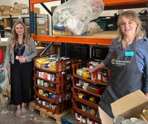 Chair of the Airport Community Network Emma Stone (left) handed over the donations to the Message Community Grocery