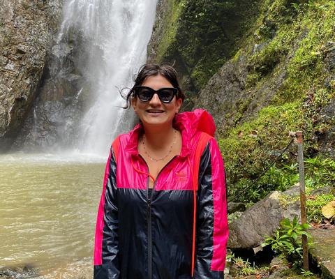 Me_in_front_of_the_waterfall_we_walked_to_with_Neimani.jpg