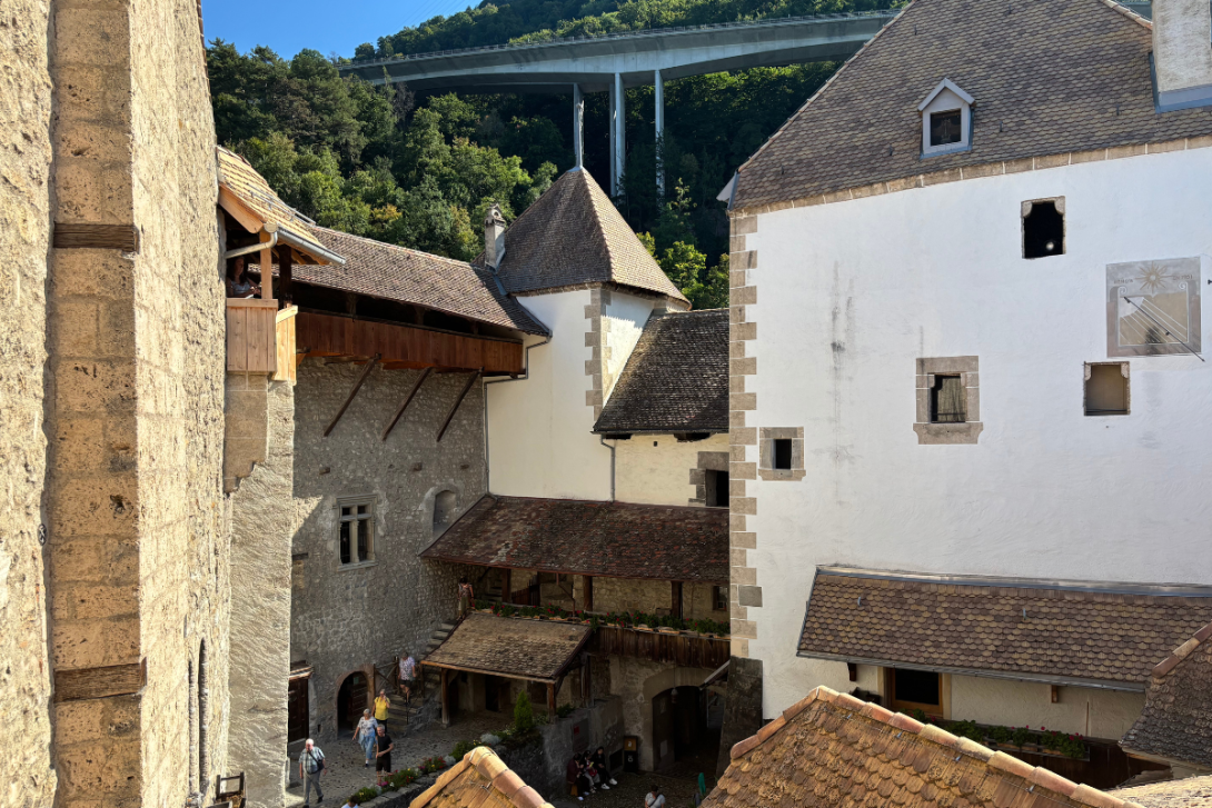 Chillon Castle is surrounded by misty mountains and stands tall on the shores of Lake Geneva chillon-castle-sustainable-travel-heroes-intrepid