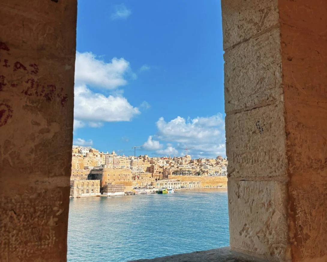 View of Valletta city in Malta through a stone framed window