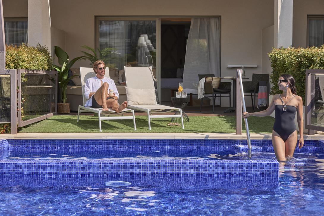 A couple swim at the Zafiro Palace Palmanova
