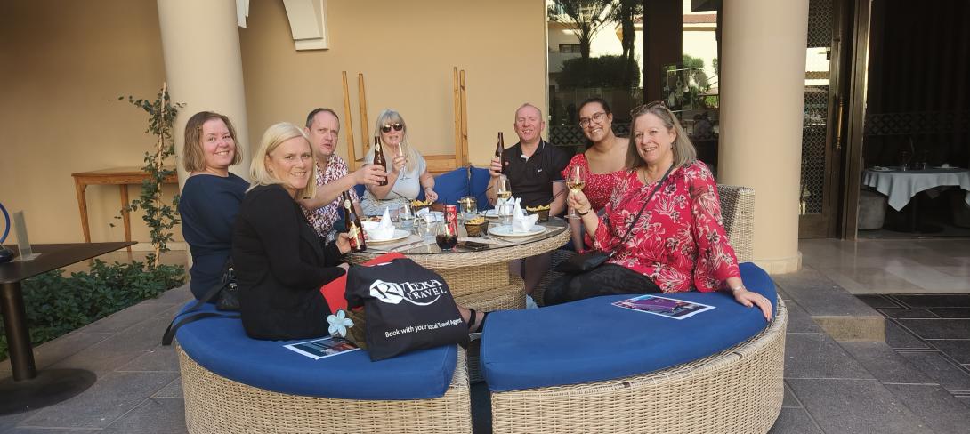 The group enjoy drinks together