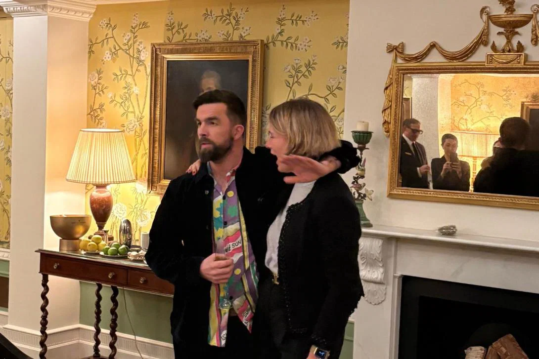 Man and woman speaking at event