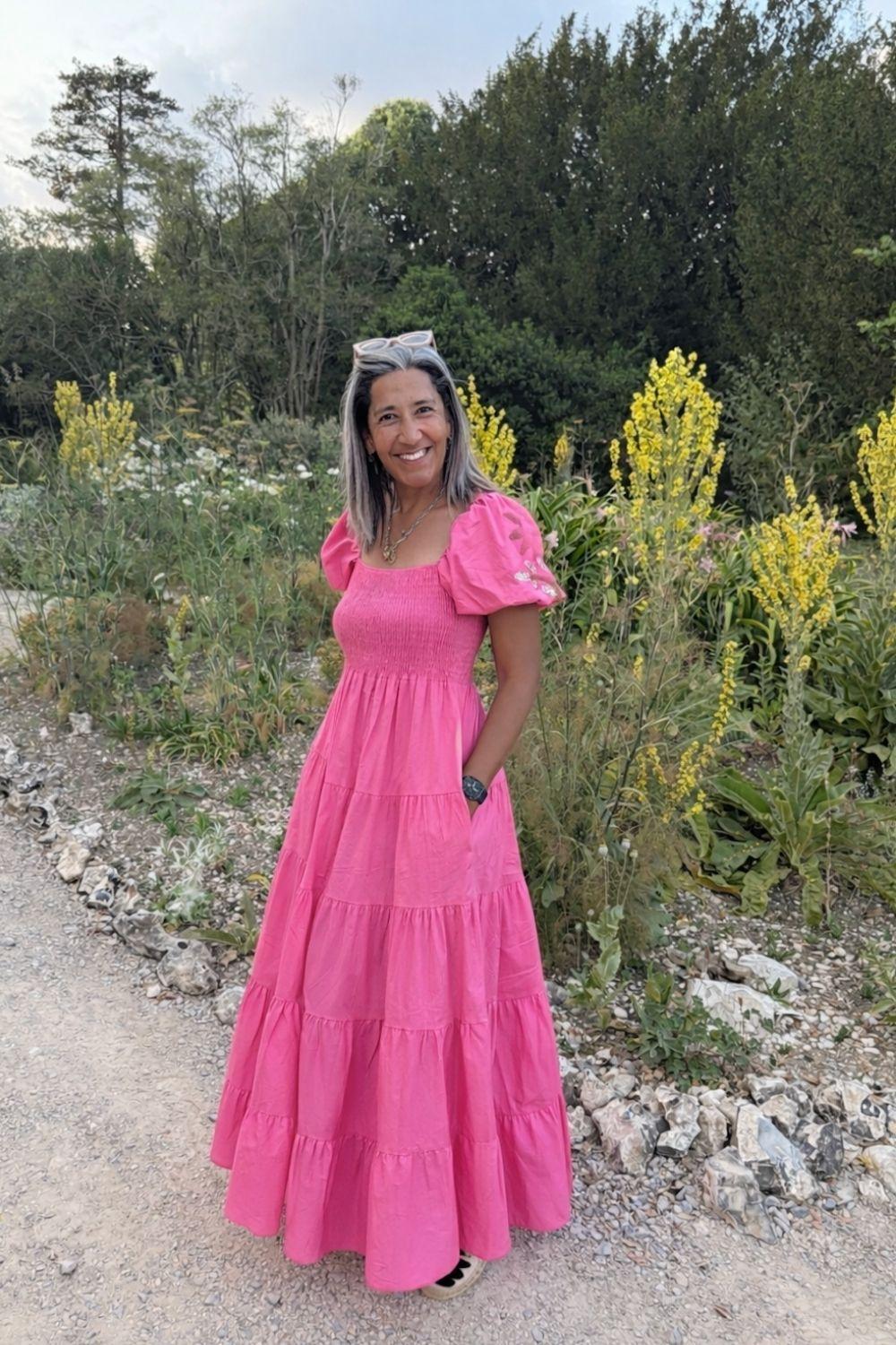 Woman smiling in pink dress