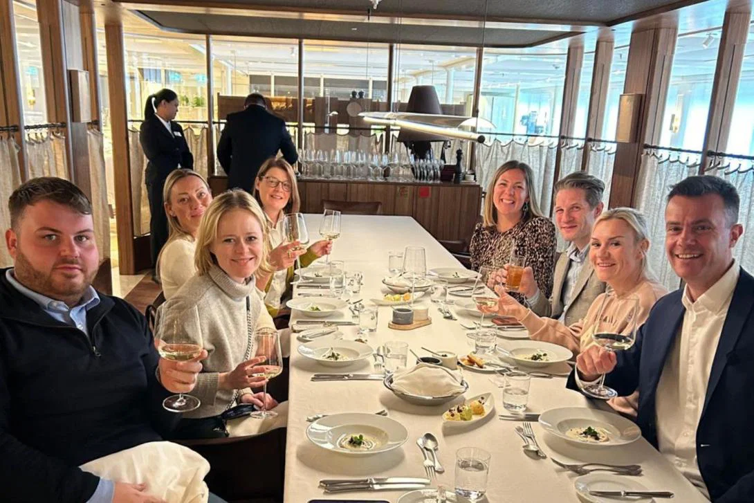 Group of people at fancy lunch on river ship