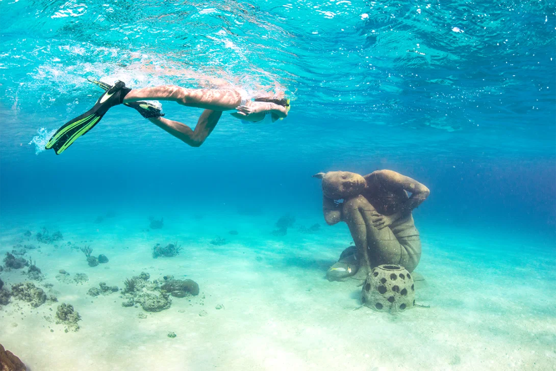 (credit: Nassau & Paradise Island Promotion Board) Person snorkelling by underwater sculpture
