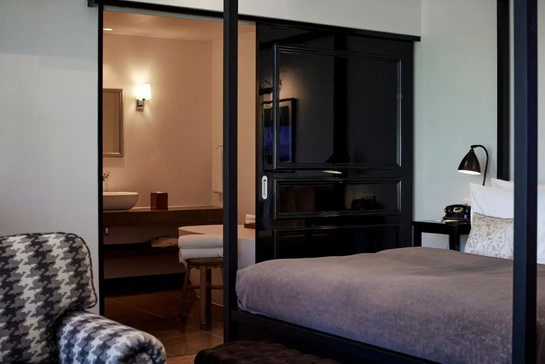 Luxury hotel room with four poster bed and en suite