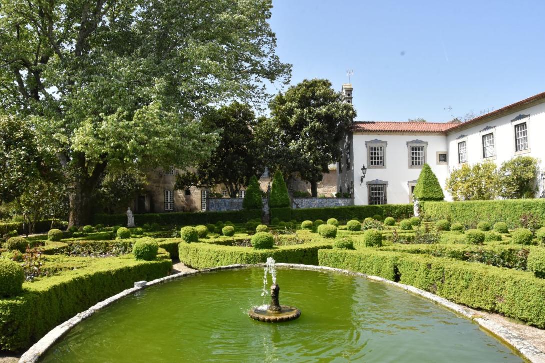 A fountain in a manicured garden