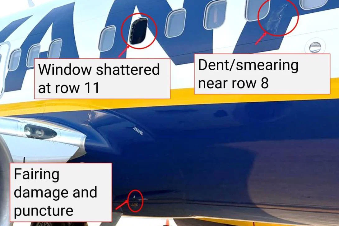 The window was shattered by a broken engine fan blade