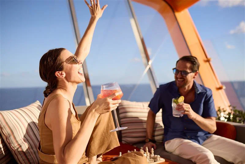 Customers smiling onboard Celebrity Cruises ship