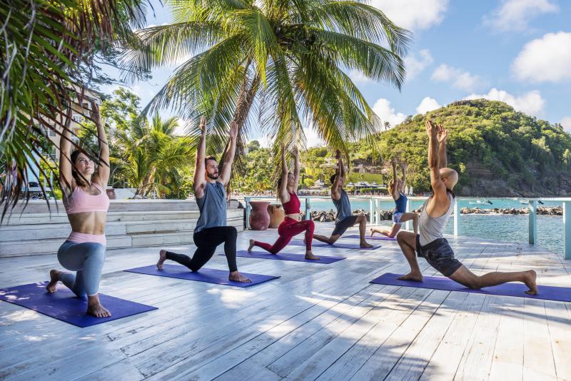 Guests can opt for yoga on the beach as one of the myriad activities included in their package