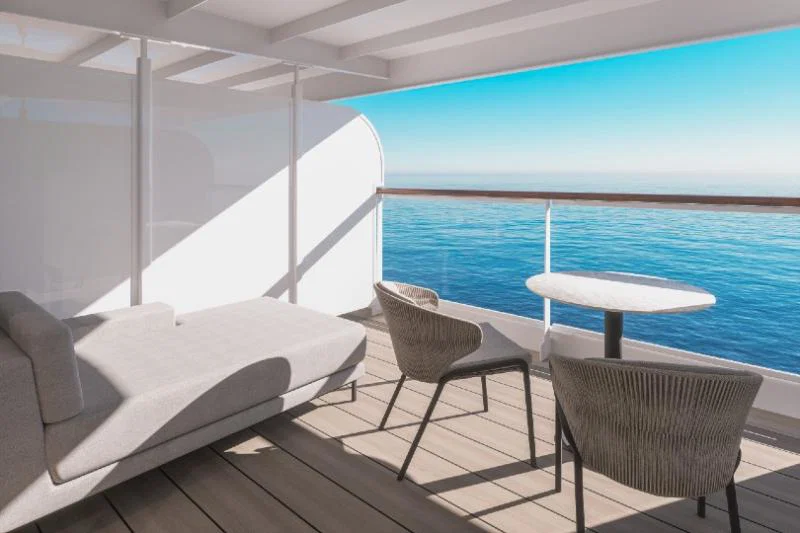 The private terrace in an ocean grand terrace suite, featuring a daybed and dining area