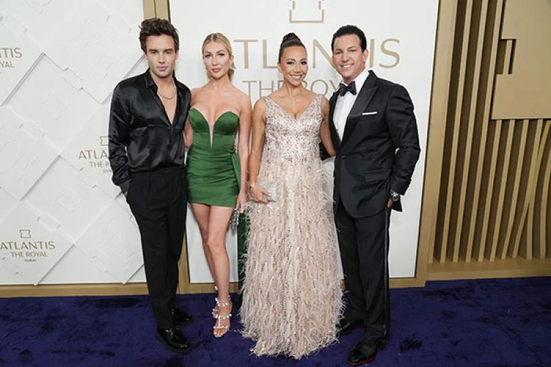 Liam Payne (left) is joined by actress and partner Kate Cassidy (second from left) and executive vice president of Atlantis Timothy Kelly (right) and guest at the event