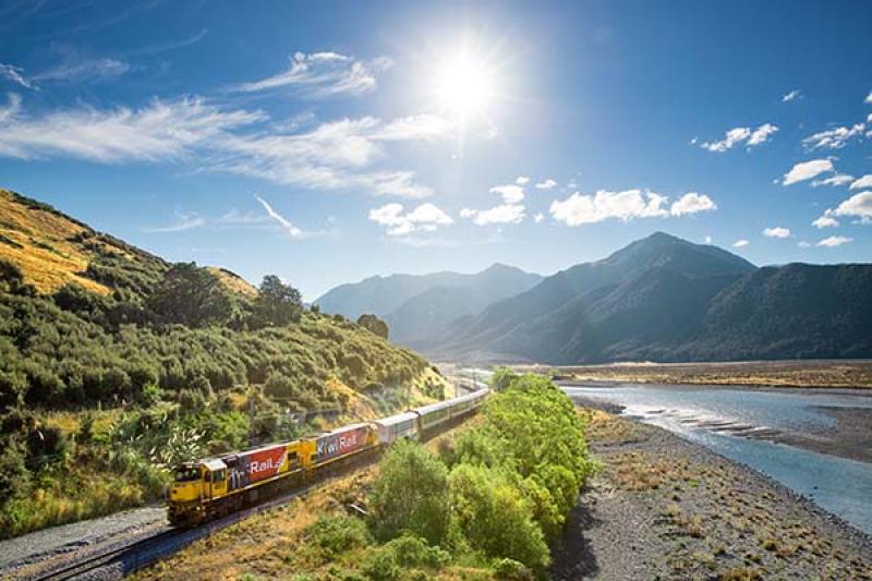 TranzAlpine train alongside the Waimakariri River. Credit Great Journeys of New Zealand
