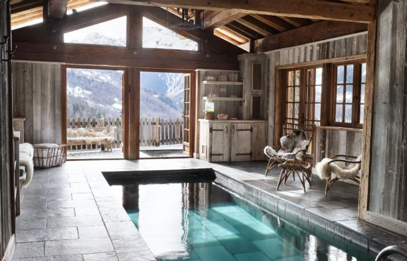 The chalet's R&R area features a pool, outdoor hot tub, steam room and sauna
