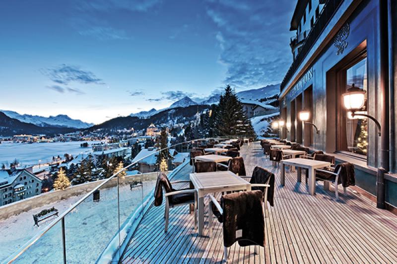 The Carlton Hotel sits above the town of St Moritz and looks over the frozen lake