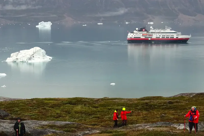 Dixon (bottom right) explores ashore