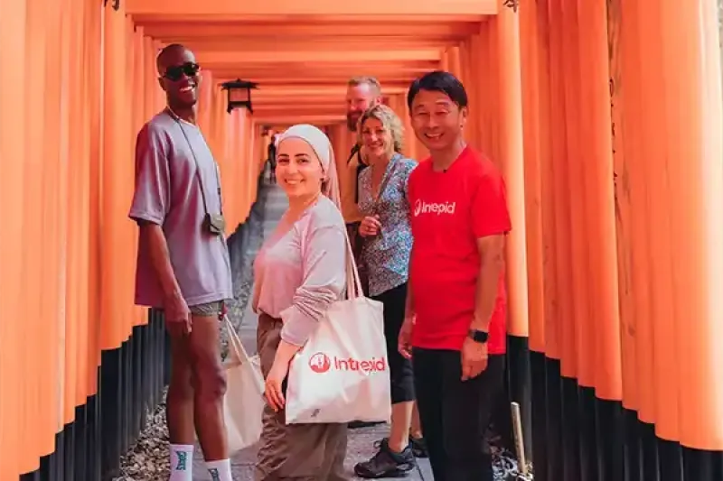 A group exploring the Fushimi Inari shrine in Kyoto with Intrepid Travel