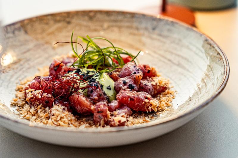 The red tuna tartare with truffle vinaigrette and egg yolk is a menu highlight at Chiringuito