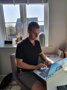 Lee Trowbridge at desk