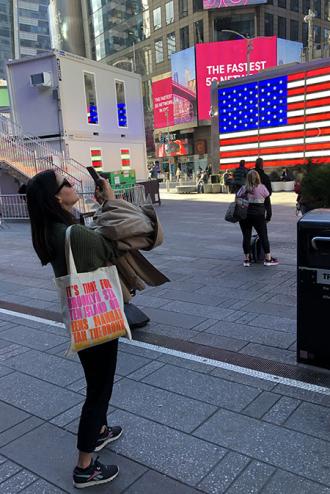 TTG features editor Abra takes a picture in Times Square